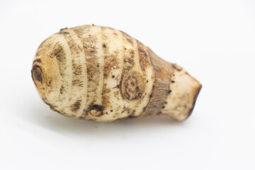 Taro root also known as Arbi on white background.