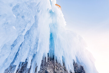 Banner blue clear ice cave on Baikal lake in winter landscape