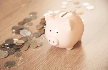 piggy bank with money on the desk
