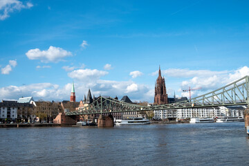 Fototapeta na wymiar skyline of Frankfurt with old pedestrian footbridge Eiserner Steg engl: iron footbridge