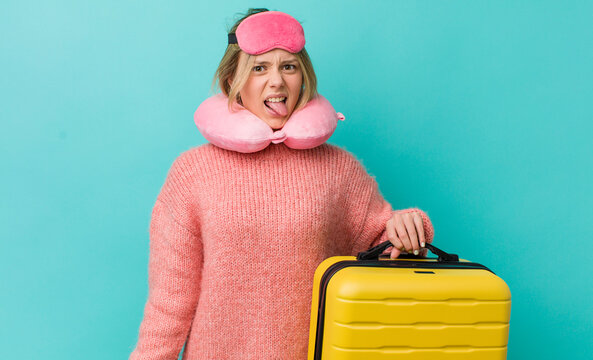 Pretty Blonde Woman Feeling Disgusted And Irritated And Tongue Out. Flight Passenger Concept