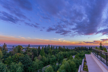 Panoramic sunset view across Fraser Valley, BC, as viewed from a Burnaby Mountain patio garden.