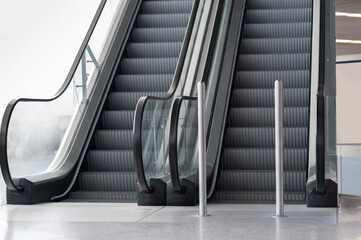 Interior of new airport terminal with escalators