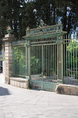 Entrance to France's oldest botanical garden. The inscription at the old wrought iron gate tells that the garden of plants of the university of Montpellier was established in 1593 by (King) Henri IV. 