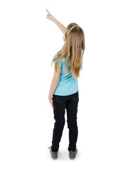 Back view of little girl points at wall. Rear view. Isolated on white background
