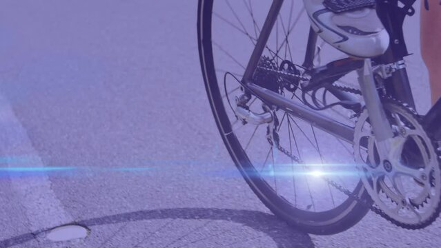 Animation of light spots over caucasian woman cycling