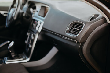 Fototapeta na wymiar Air vent grill in modern car interior.