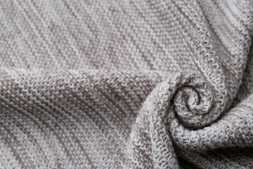 Beautiful grey knitted fabric as background, top view