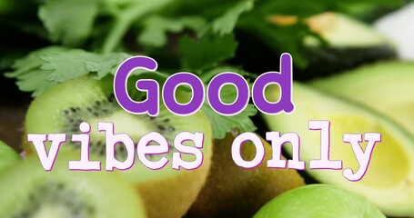 Animation of good vibes only text over close up of fresh fruit and vegetables
