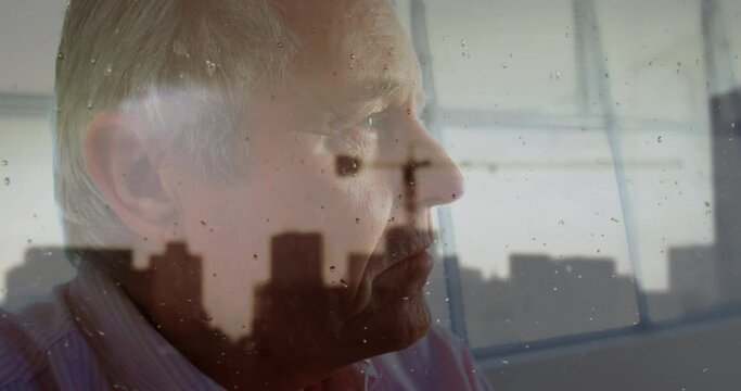 Animation of cityscape over sad senior caucasian man - Powered by Adobe