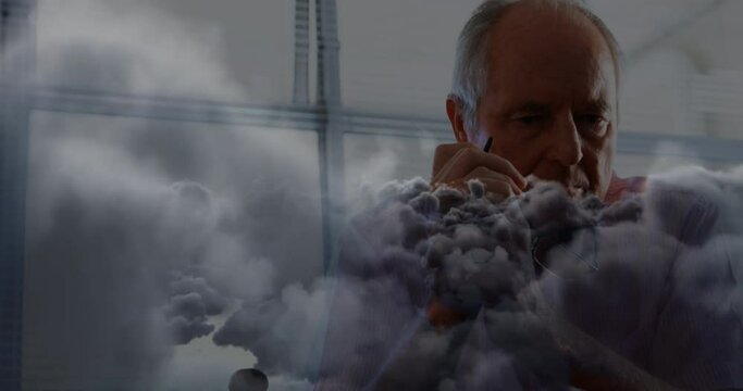Animation of clouds over sad senior caucasian man - Powered by Adobe