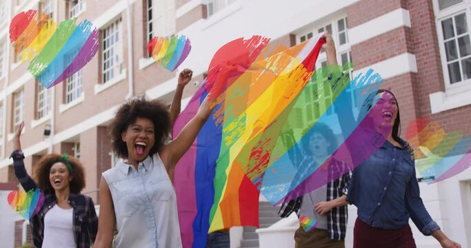 Video of rainbow flags over diverse people holding lgbtq flag at demonstration