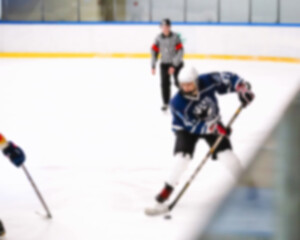 Obraz premium Defocused hockey match fast attack on the gate - hockey players in motion blurred background