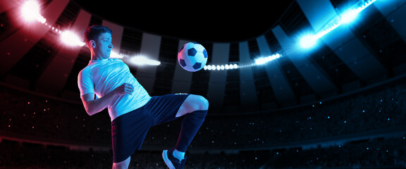 Mixed light. Bright dynamic collage with professional soccer, football player kick the ball in jump...