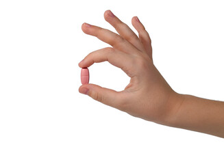 Large oval pill with dosed division in two fingers an elegant hand. Isolated on a white background.