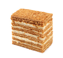 Slice of delicious layered honey cake isolated on white
