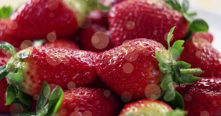 Animation of spots over fresh strawberries