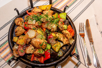 Pan-fried potatoes, meat and vegetables for a large company