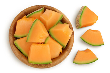 Cantaloupe melon pieces in wooden bowl isolated on white background with clipping path and full...