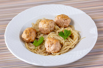 Spaghetti pasta with meatballs and tomato sauce, selective focus