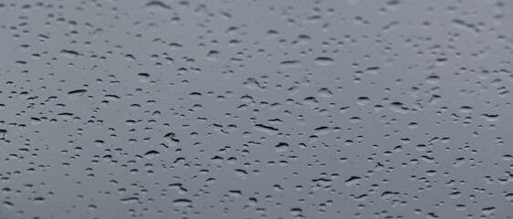 Rain drops on the glass. Banner with raindrops on the window