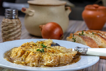 Classic French onion soup baked with cheese croutons