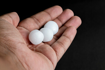 Naphthalene balls on the hand
