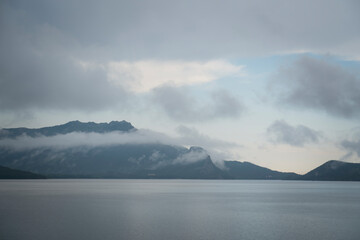 Kazakhstan, Borovoye (Kokshetau). Fog over the lake after rain. Lake Borovoye or Auliekol (sacred lake) is one of the largest in the system of Kokshetau lakes. High quality photo