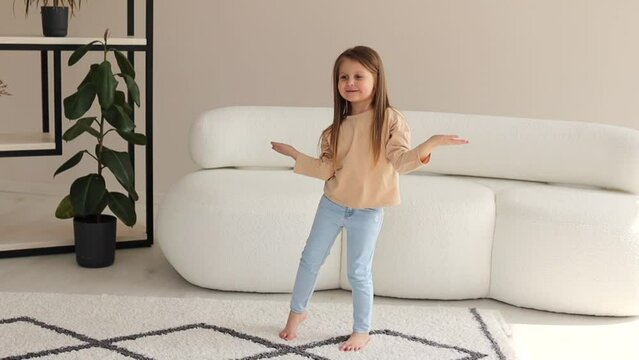 Authentic shot of a beautiful little girl dancing and having fun.
