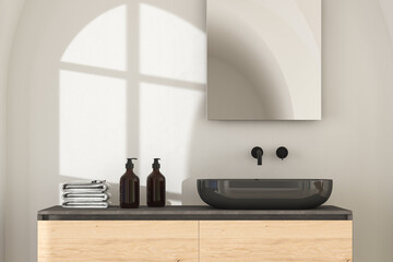 Close up of black sink with square mirror standing in on white wall , wooden cabinet with black faucet in minimalist bathroom. Front view. 3d rendering

