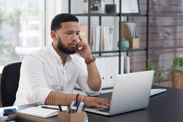 I need to complete all my deadlines today. Shot of a young businessman working on a laptop in an office.