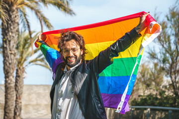 transgender person with LGBT flag