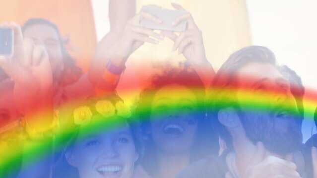 Animation of rainbow over group of happy people