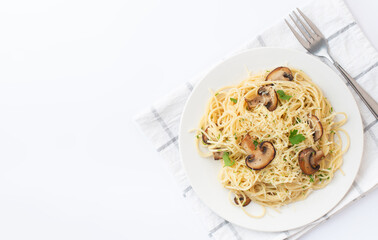 pasta with mushrooms and cheese on a white plate