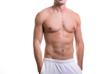 Obraz premium body of a young caucasian male athletic naked to the waist isolated on white background