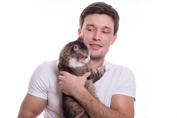 young white cute man tenderly holds a cat in his hands on a white background