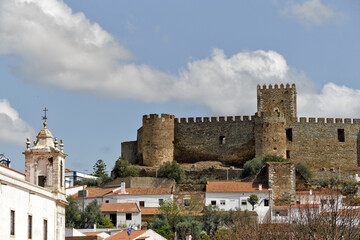 Fototapeta na wymiar Hilltop ruins of a castle dating to the 1200s offering vistas over the town of Portel, Portugal