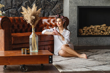 a young girl sits at home and buying gifts online