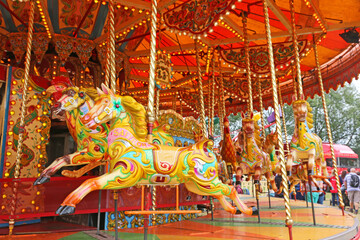 	
Horses on a vintage merry go round	