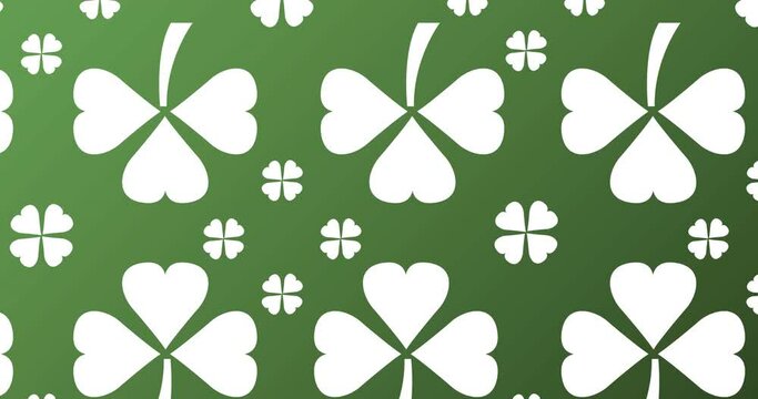 Animation of multiple white clover leaves moving on green background