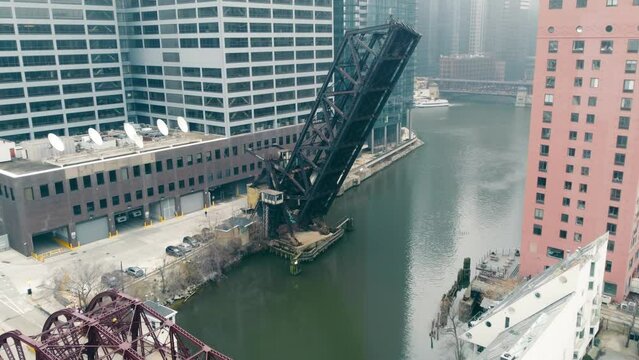 Flight over An old bridge in the city. Kinzie Street Bridge. The Chicago River at Wolf Point. Chicago Northwestern Railway Bridge