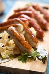 Grilled german sausage links with sauerkraut