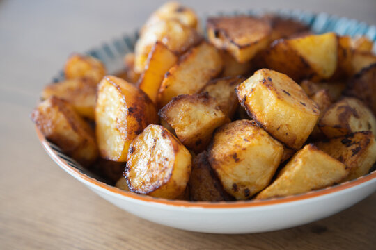 Roasted potatoes served in bowl