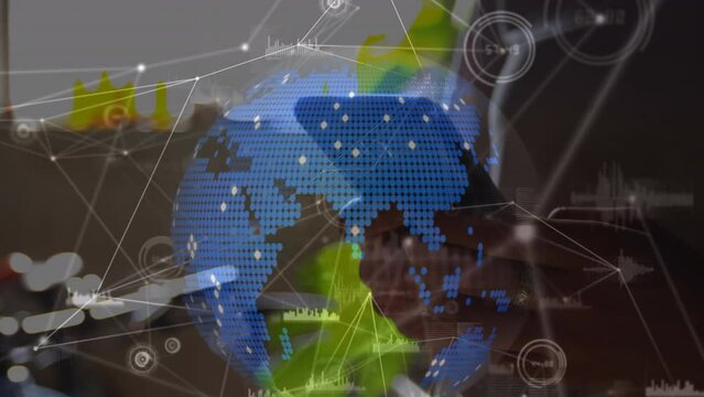 Animation of globe and data processing over caucasian businesswoman using smartphone