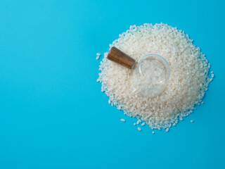 Rice cereal in the small bowl on blue background.