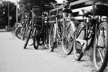 Street bike parking. Black and white horizontal photo.
