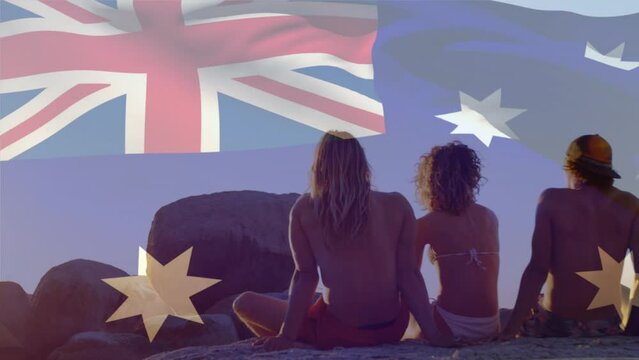 Animation of flag of australia over diverse group of friends at beach