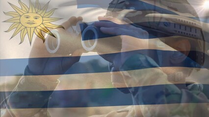 Animation of flag of uruguay over biracial male soldier with binoculars - Powered by Adobe