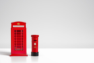 Red model telephone and post box London concept