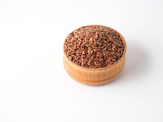 Flax seeds in the wooden bowl.